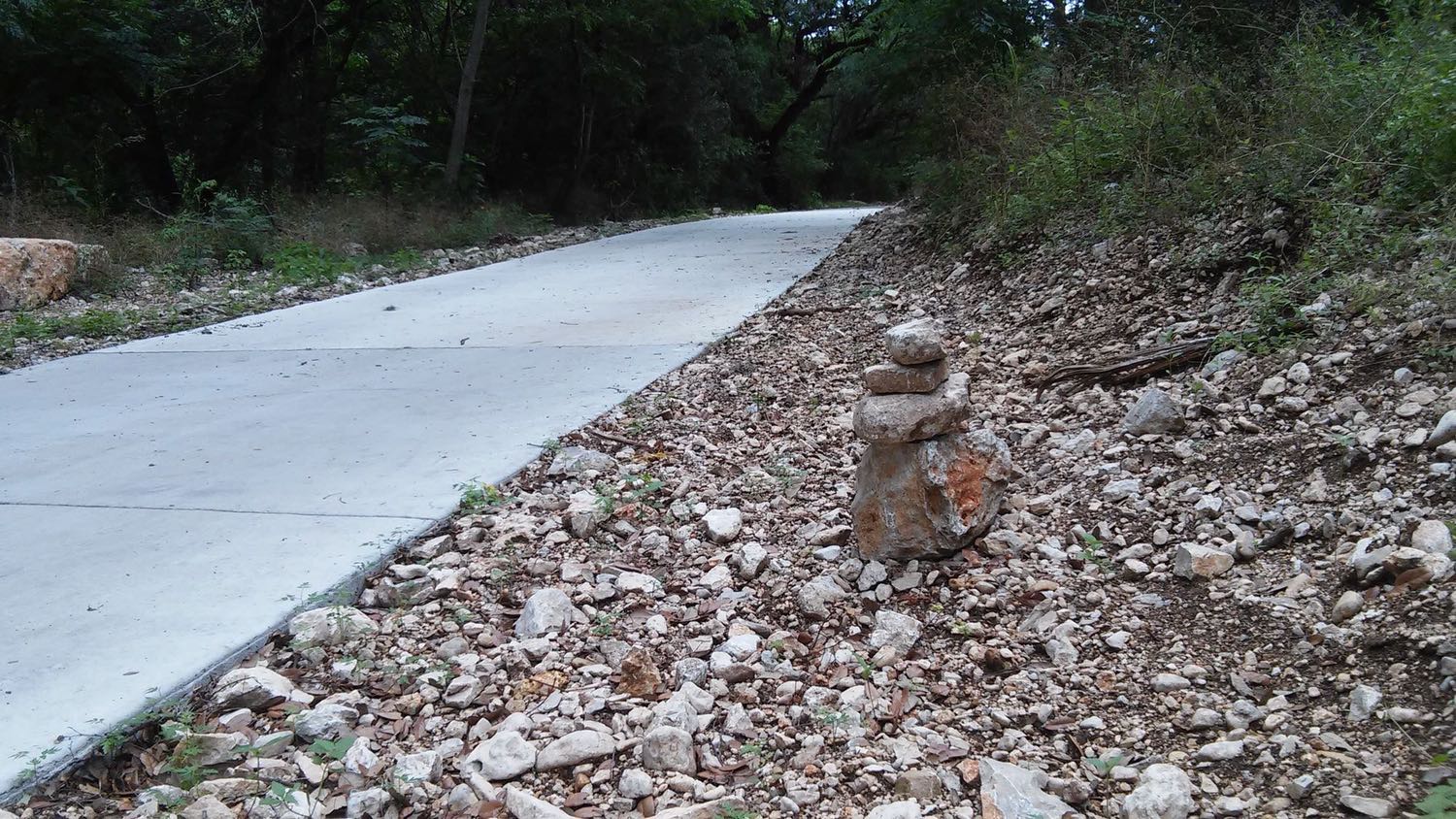 A rock statute greets those on the trails