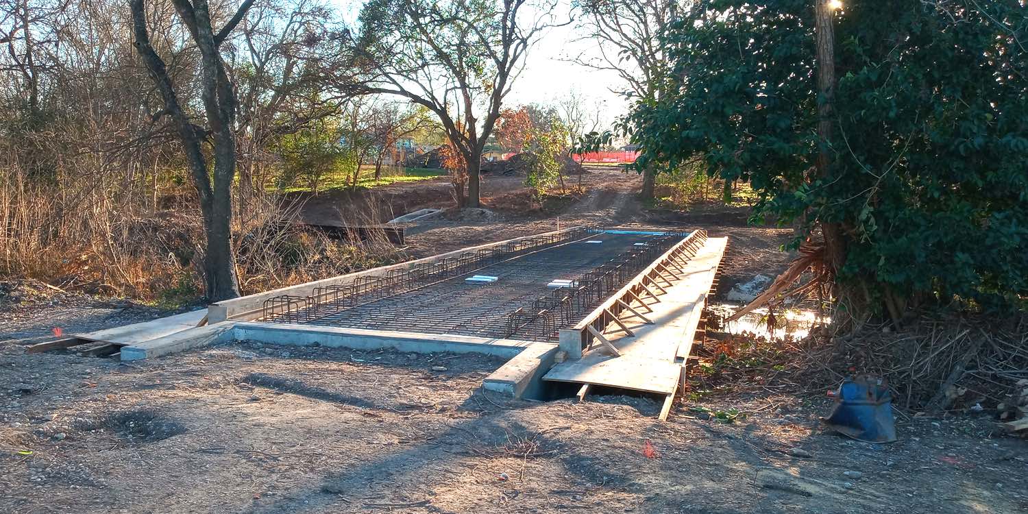 New, wide bridge under construction to connect Salado Greenway to Grantham Drive