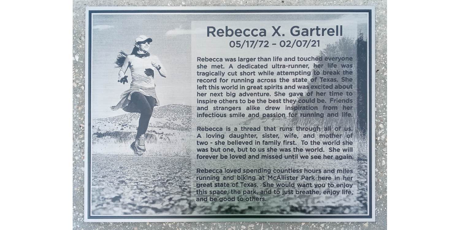 Monument displays image of Rebecca Gartrell engraved with a description of her life as an avid runner