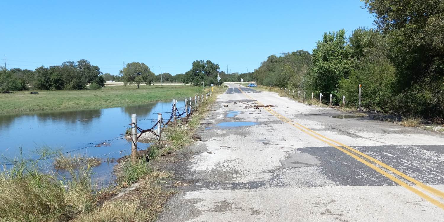 Actually, it is backed up floodwaters of Salado Creek that runs over N.E. Entrance Road—Photo: SRR